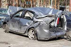 Wreck Prints: Broken car after a traffic accident in the parking lot of a repair station