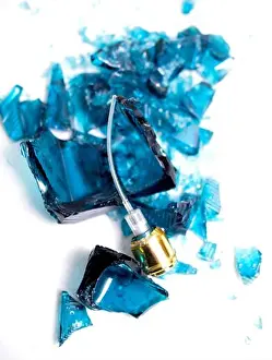 Sprayer Prints: Broken perfume bottle on white background