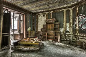 Rundown Prints: Broken and vandalized piano in an abandoned manor