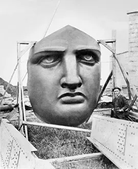 New York Prints: The bronze face of the Statue of Liberty uncrated awaiting installation in 1885 on Liberty Island
