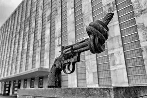 United Nations Prints: Bronze non violence sculpture also called the Knotted Gun by Carl Frederik Reuutersward outside United Nation General