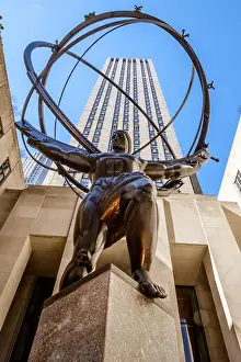 Heavens Prints: Bronze statue Atlas, depicts the Ancient Greek Titan holding the heavens in the forecourt of Rockefeller Center