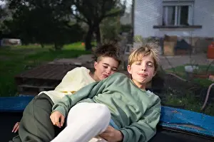 Siblings Prints: Two brothers are lying on a trampoline