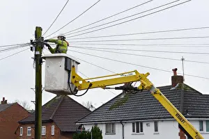 Cables Prints: A BT Openreach engineer working on telephone cables from a cherry picker