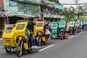 Naga Prints: A bunch of motor taxis in the streets of Naga city, Bicol Region, Philippines