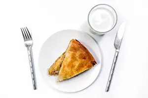Serbian Prints: Burek Traditional Pie With Meat Served On The Plate with Yogurt and ustenils