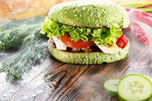 Hamburger Prints: burger with green bun in light smoke on wooden background