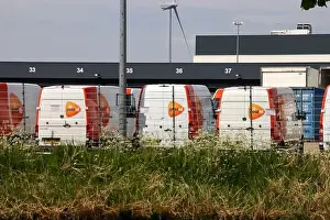 Buses of the PostNL parcel delivery service in Waddinxveen at Doelwijk in the Netherlands