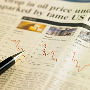 Stuff Prints: business article a graph and a pen on a newspaper