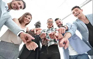 Executives Prints: Business people pointing at the camera isolated on white