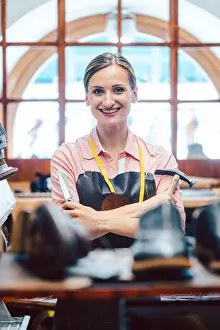 Repairing Prints: Business portrait of owner in her small cobbler workshop