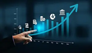 April Prints: A business professional points at a digital growth chart depicting financial metrics and icons