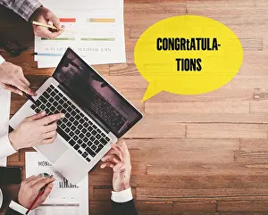 Admiration Prints: BUSINESS TEAM WORKING IN OFFICE WITH CONGRATULATIONS SPEECH BUBBLE ON DESK