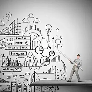 Sketching Prints: Businessman drawing plan strategy success with huge pencil