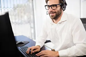 Well Dressed Prints: Businessman with glasses smiling and working