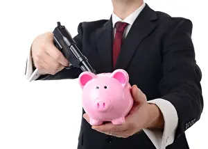 Threats Prints: businessman holding bank to ransom with a gun isolated on a white background