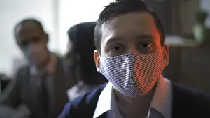 Well Dressed Prints: Serious Businessman In Protective Mask Backlit By Red Neon