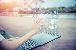 Businesswoman hand using advance technology computer hologram air screen display projection business information data