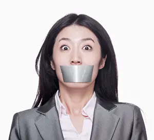 White Collar Prints: Businesswoman with her mouth caver with duct tape