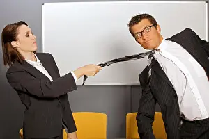 Well Dressed Prints: Businesswoman pulling businessman by tie