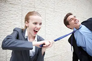 Pulling Prints: businesswoman pulling businessman's neck tie
