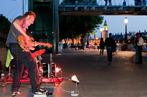 Loud Prints: Busker Playing Under A Railway Bridge South Bank London UK Europe