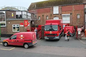 Vans Prints: A BUSY SCENE WITH RED ROYAL MAIL DELIVERY VANS AND TRUCK OUTSIDE A TOWN CENTRE DELIVERY OFFICE IN RYE
