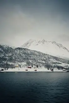 Brim Prints: Cabins by the arctic ocean in winter in the snowy Lyngen Alps in Norway