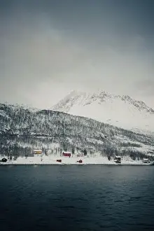 Brim Prints: Cabins on the bank by the arctic ocean in the snowy Lyngen Alps in Norway