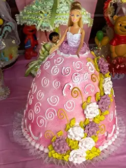 Adornment Prints: A cake in the shape of a Barbie Doll's dress is on display at a bakery in the Bronx