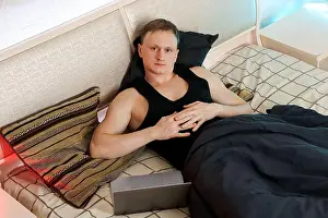 Unwind Prints: Calm man folds hands over stomach