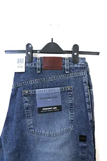 Trousers Prints: Calvin Klein Straight Leg Jeans Hanging On Door