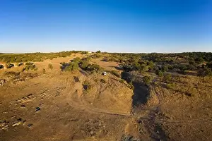 Camper Van Prints: Camper van drone aerial view alone on an Alentejo landscape between the trees, in Portugal