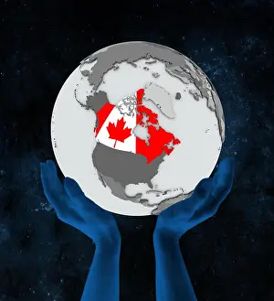 Globe Prints: Canada with flag on globe in hands in space. 3D illustration.