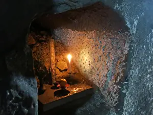 Enlightenment Prints: Candles light up the interior of the Taya Caves at Kamakura