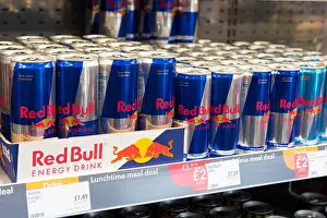 Red Bull Prints: Cans of Red Bull on display for sale on a supermarket shelf