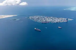 The capital of Maldives from the sky. Aerial view on male the capital city of maldives. overcrowded island in the indian ocean blue ocean sea