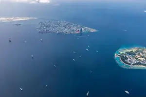 The capital of Maldives from the sky. Aerial view on male the capital city of maldives. overcrowded island in the indian ocean blue ocean sea