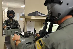 Us Military Prints: Capt. Dennis Zabka checks his mask for leaks at Barksdale Air Force Base