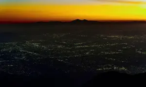 City Lights Prints: Captivating view of San Bernardino Valley at dusk from Rimforest