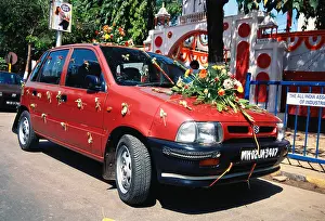 Wheeler Prints: Car decorated with flowers for marriage ceremony ; model Zen Lx ; Maruti Suzuki ; India ; asia