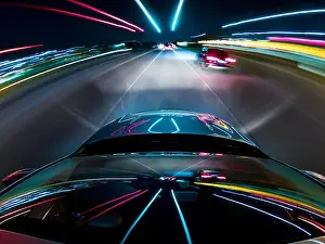 Freeway Prints: Car driving along a motorway at night, USA