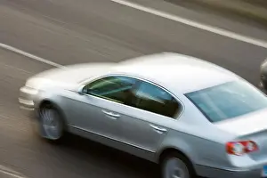Speeding Prints: Car on motorway. UK