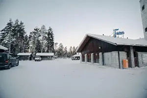 Boreal Prints: Car park and snowmobiles in wildlife park in Ranua, Lapland