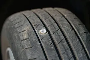 Tread Prints: Car tyre punctured by a metal nail