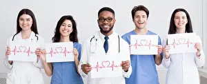 Cardio Prints: Cardiology concept. Doctors holding papers with cadiograms of heartbeat
