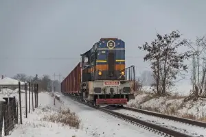 Turntable Prints: Cargo train with motor engine in winter snowy morning near cold village Lenesice CZ 12 09 2023