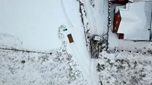 Construct Prints: Cargo transportation.Clip. Winter track shot from a height on huge loaded cars next to fences