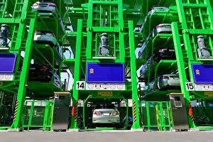 Automated Prints: Many cars are parked in automatic multi level open space car parking lot