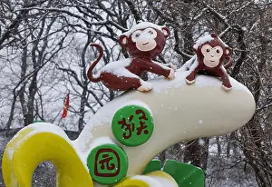 Monkey Prints: A cartoon monkey is covered with snow at the Monkey Garden of Yuntaishan Scenic spot in Lianyungang city